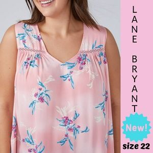 Pink floral sleeveless top.